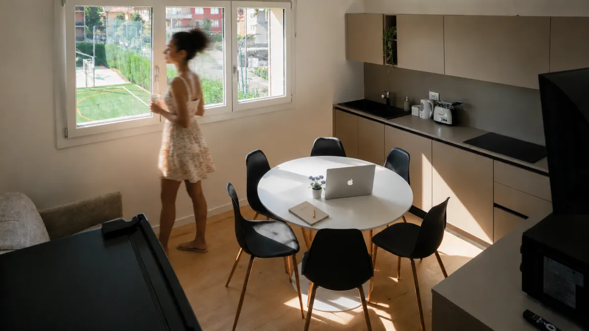 Suite San Marco: a person with a laptop by the kitchen window, work comfortably during your stay